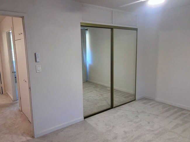 Building Photo - Available Now | 2 Bedroom, 2 Bathroom Townhouse with 1 Assigned Parking Stall at Tropic Gardens 1