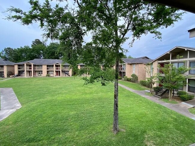All buildings overlook the large green space - Royal Oaks Apartments