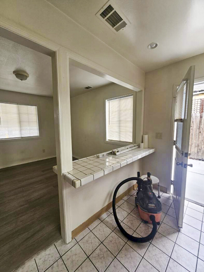 Kitchen facing the living room & kitchen door entrance. - 4034 W 159th St