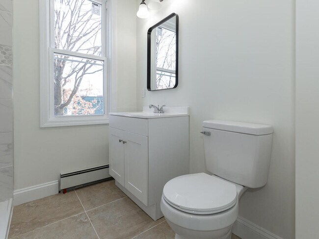 These photos are from Unit #2, but the bathroom in Unit #3 is equally as updated; the colors do vary - 33 Valley St