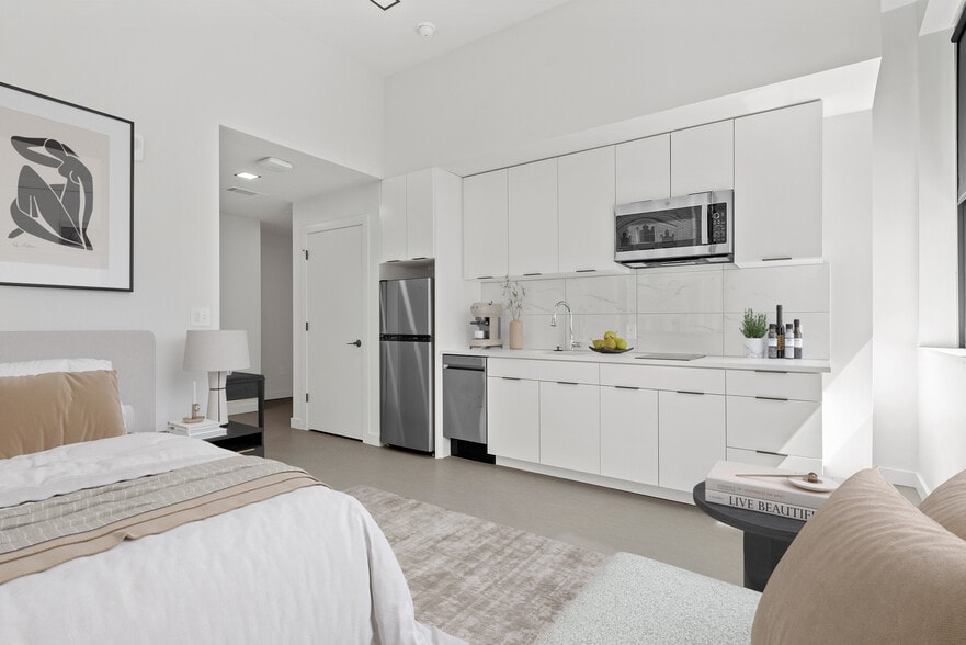 The kitchen and living space of The Broadway at Midland Lofts - Midland Lofts
