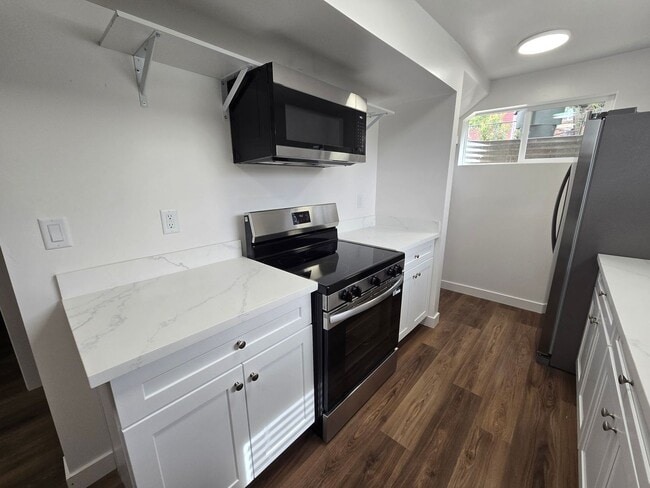 Building Photo - Remodeled 4 Bed, 2 Bath with Double Kitchen & Covered Carport