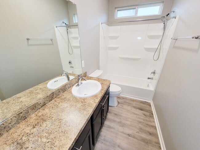 Building Photo - Welcome to this charming one-story home fe...