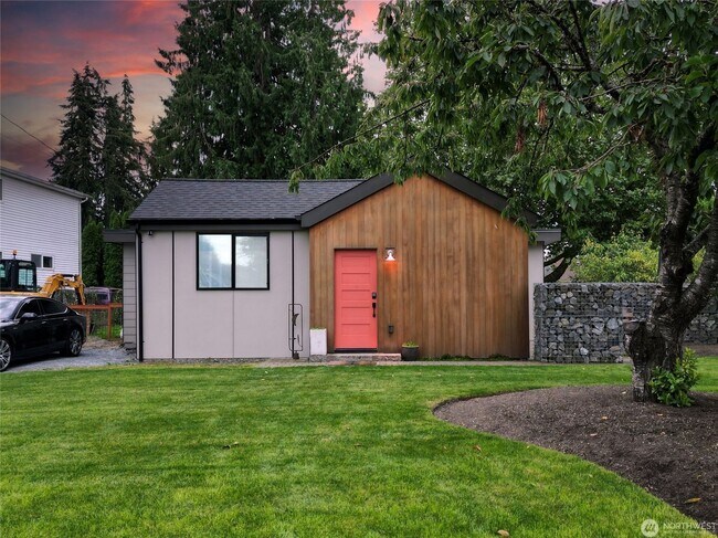 Building Photo - Remodeled 3 bdrm home on a large lot with 500 sq ft wrap around deck!