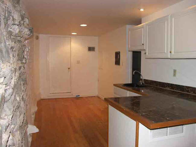 Kitchenette, extra space, Bedroom door on L, bathroom door on R - 3118 Dumbarton St NW