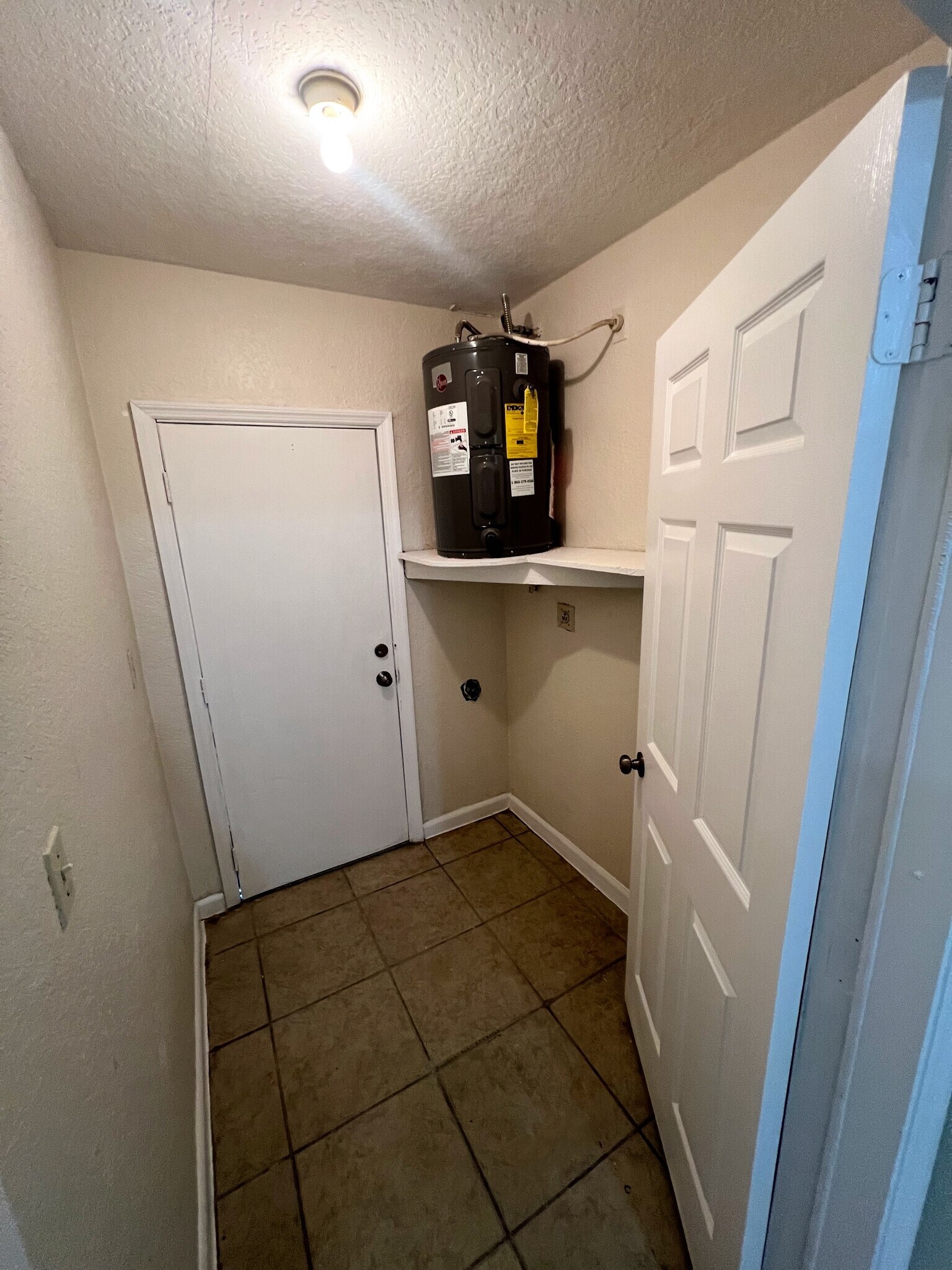 Storage area/water heater room - 1426 NW 8th Ave