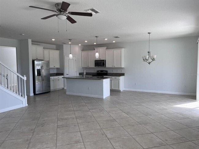 Building Photo - "Spacious 5-Bed Retreat with Elegant Hardw...