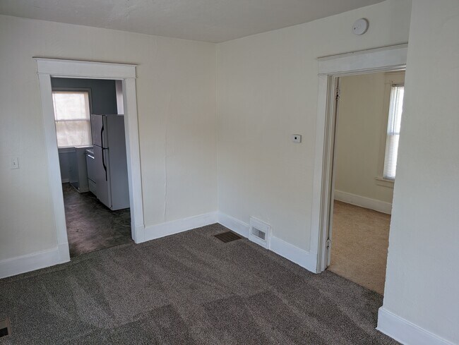 Main floor bedroom 3 and kitchen from dining room - 830 Y St