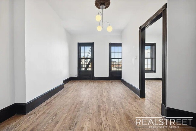Building Photo - Timelessly Renovated Historic Triplex with...