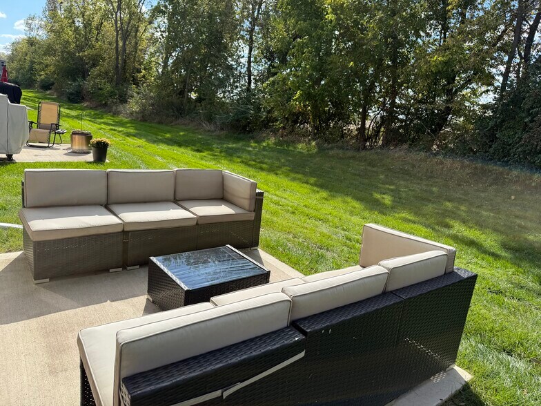 Patio with seating and table - 4521 SE Ember Ln