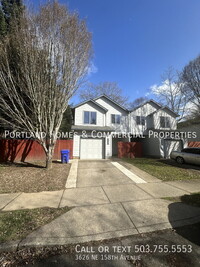 Building Photo - NE Duplex with Fenced Backyard