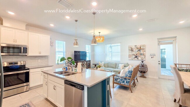 Building Photo - EXCEPTIONAL AND SPACIOUS FURNISHED TOWNHOME WITHIN WATERSIDE- NAUTIQUE!