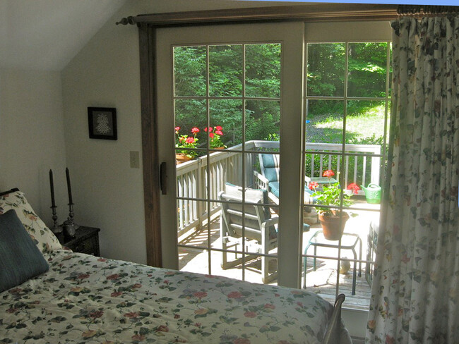 Primary bedroom; sliding doors to deck - 274 Bruning Rd