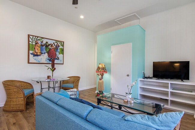 living dinning area with Smart TV dining table two chairs and couch - 244 Awakea Rd