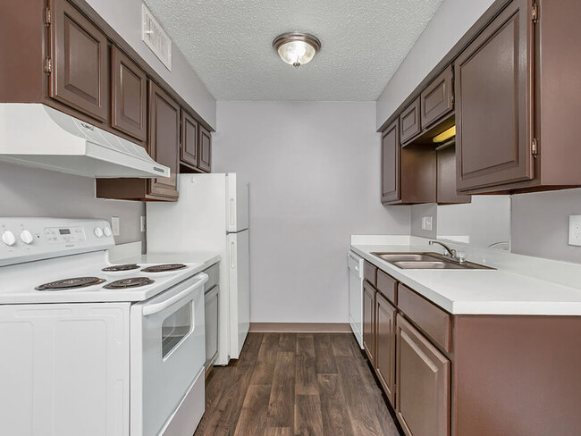 Dark Cabinetry Kitchens Available - Mt. Carmel Village Apartments