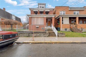 Building Photo - Bright and Roomy 6-Bedroom in McKees Rocks with Garage
