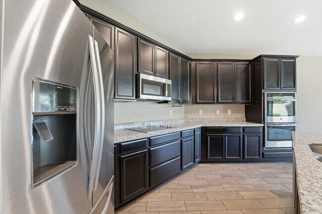 Building Photo - Stunning 4-Bed + Den Eastmark Home with Modern Upgrades Throughout