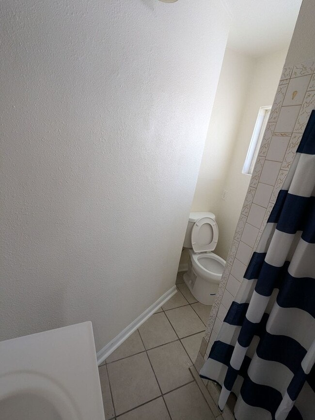 Building Photo - Ground Level 2 Bedroom, 2 Bath apartment. New flooring and paint. Tenant pays electric and natura...