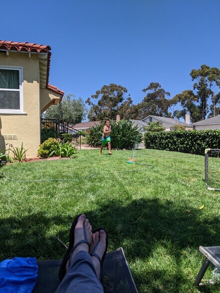 front yard with sprinklers on timer (fenced) - 5762 Olvera Ave