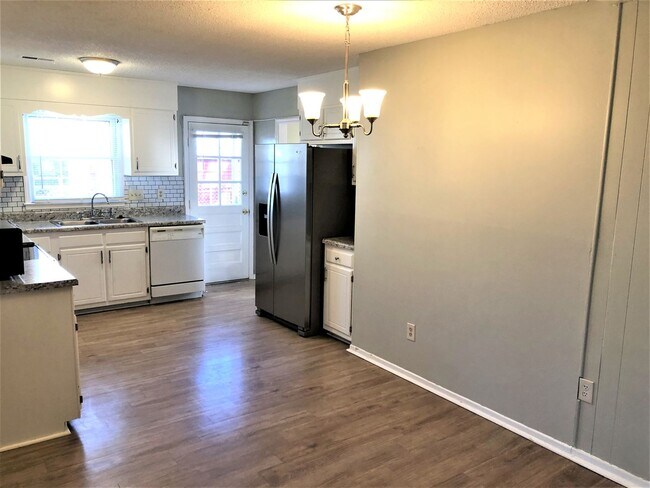 Building Photo - SW Large Brick Home, Updated Kitchen & Bathrooms, Wood Like Flooring, Fenced Yard!