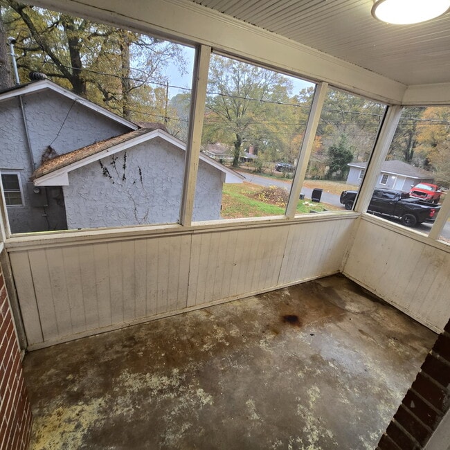 Building Photo - Full brick 3 bedroom, 1 and half bath home with screened in side porch, and an attic for extra st...