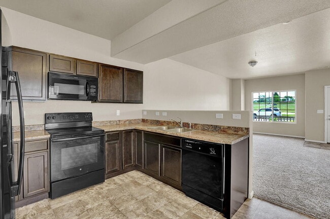 Building Photo - Modern Townhome with Central A/C, 2-Car Ga...
