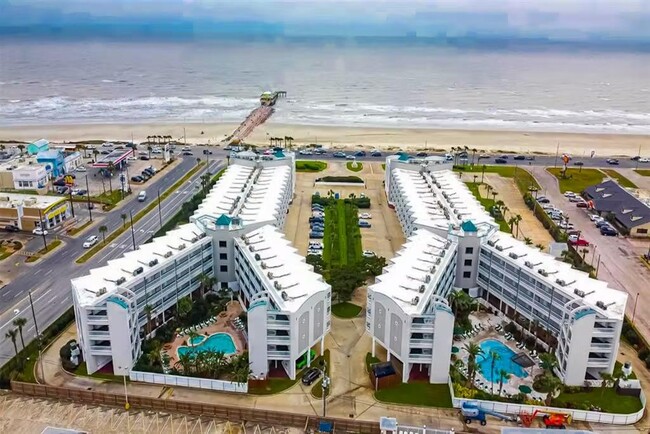 Take indoor hallway from unit to glass elevator leading to pool - 6102 Seawall Blvd