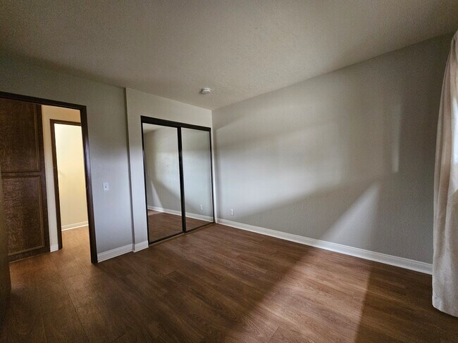 Bedroom mirrored closet doors - 2809 N Los Felices Cir E