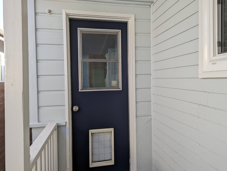 Backdoor with built-in dog door leads to the covered patio and garage - 4828 Sawtelle Blvd