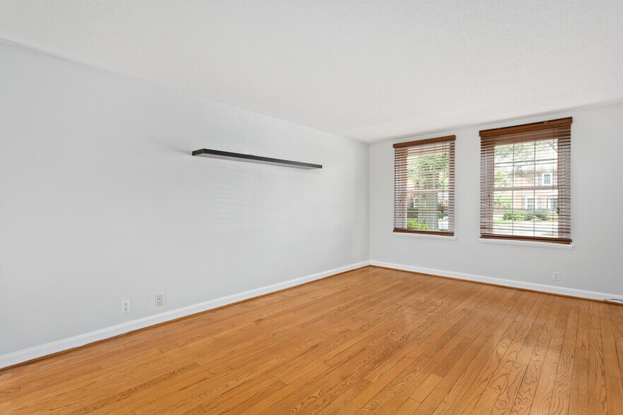 Living room w/ fresh paint, HW floors, natural light, & blinds - 4218 35th St S