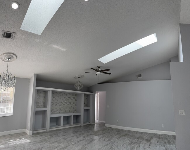 Living Room with skylight - 7644 Pointview Cir