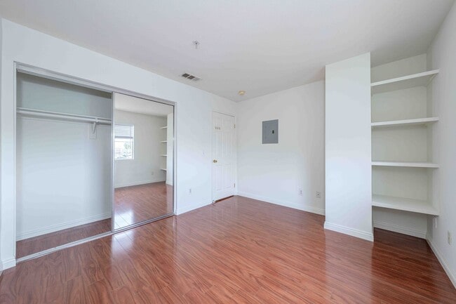 Building Photo - Gated Townhome with Updated Kitchen and Private Backyard