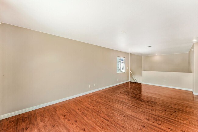 Building Photo - Stylish Two-Story Home with Loft and Dual Balconies in a Bright, Open Layout!