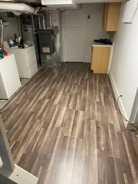 Laundry area with new flooring. - 3131 Milwaukee St