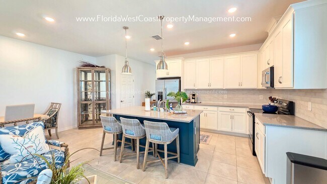 Building Photo - EXCEPTIONAL AND SPACIOUS FURNISHED TOWNHOME WITHIN WATERSIDE- NAUTIQUE!