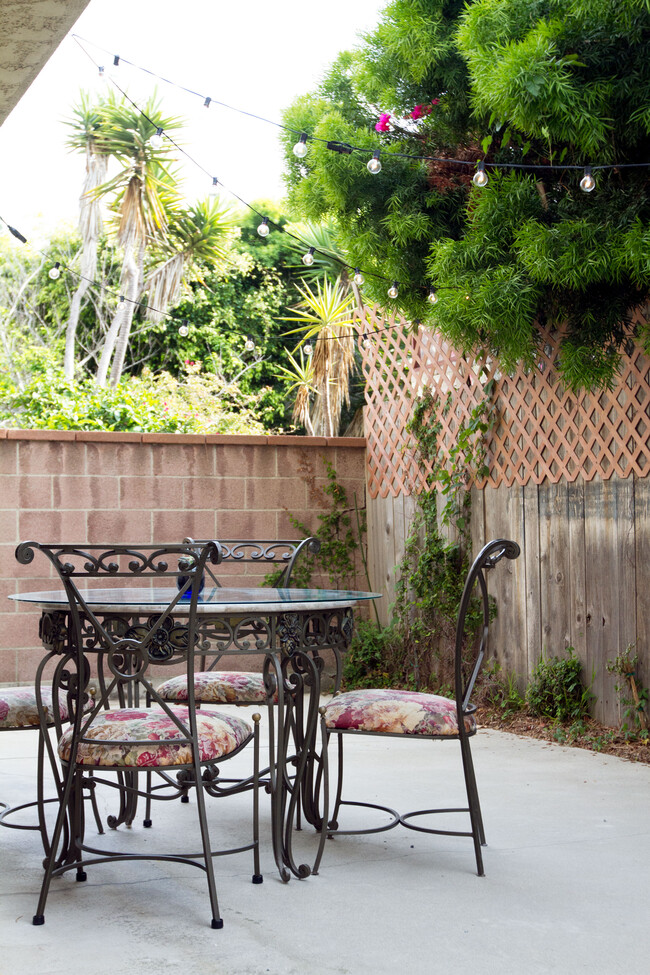 Your personal large patio with table/chairs--perfect for meals or working outdoors in the sunshine! - 6308 Vista del Mar