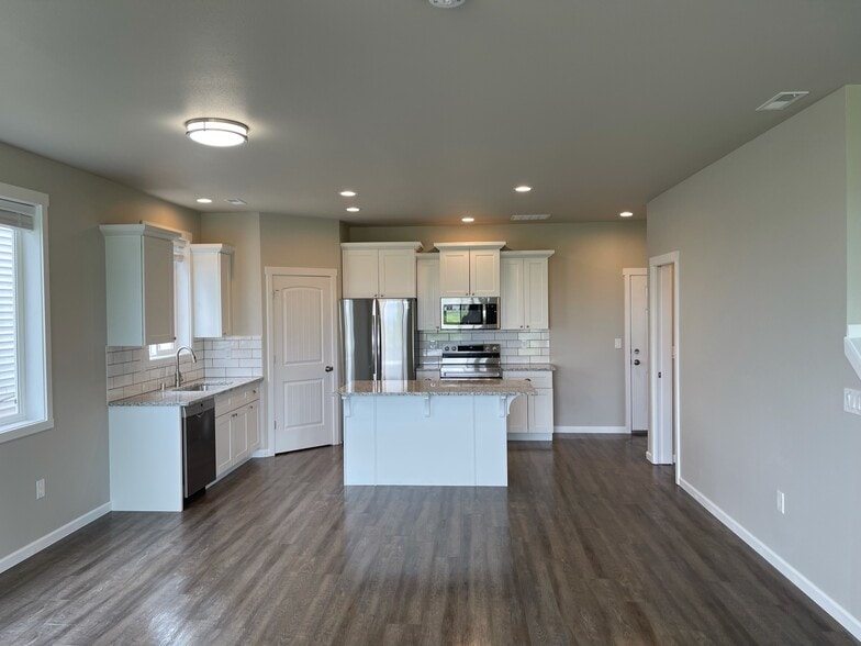 Kitchen from dining area - 9016 W Winona Rd