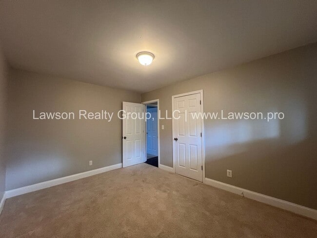 Building Photo - One Level Living- Beautifully Landscaped Yard and Attached Carport