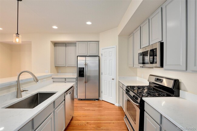 Spacious modern kitchen with Quartz countertops, gas range and SS appliances - 3680 S Beeler St