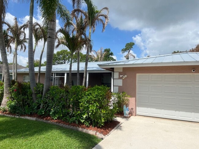 Building Photo - 3 BEDROOM 2 BATH CONVENIENTLY LOCATED WITH A TROPICAL OASIS IN THE BACK YARD!