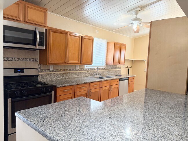 Building Photo - Gated Main House with Private Backyard & Bonus Room