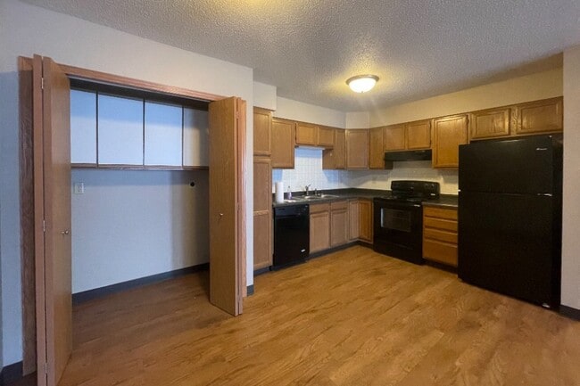 Kitchen with Laundry HookUp - Crosby Country Apartments