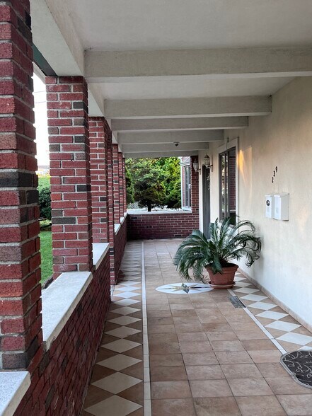 covered porch entry with left door street level acess - 239 Kingston Ave