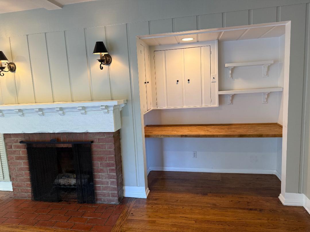 Fireplace in family room with built in desk - 4448 Carpenter Ave