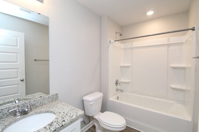 Building Photo - Coming Available Soon – 4BR/2BA Brick Home with Open Floor Plan, Solar Panels & 2-Car Garage in L...