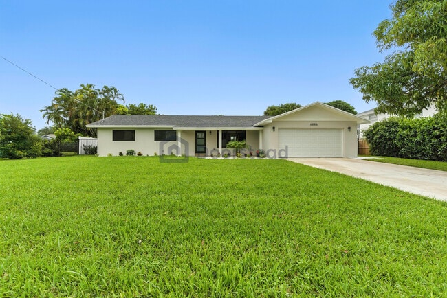Building Photo - 6886 Tradewind Way