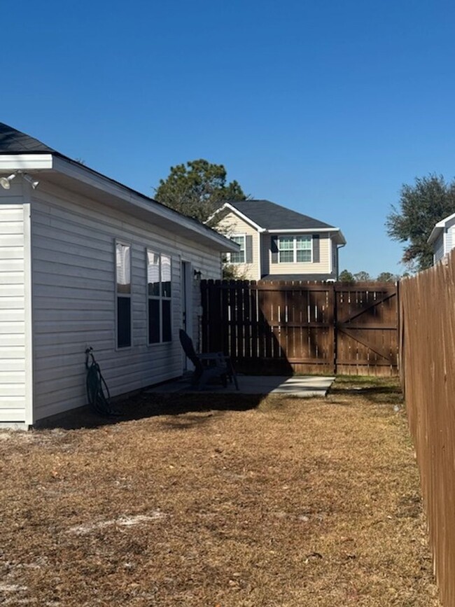 Building Photo - PRICE REDUCTION AND MOVE IN SPECIAL HALF O...