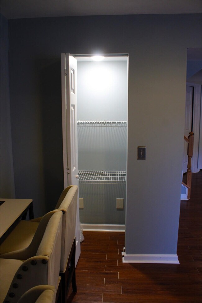 There is a full-size pantry with its own light. - 7837 Heaton Way