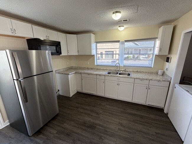 Building Photo - 3 Bedroom House - Large Storage Building and Yard - Internet and Lawn Care included!