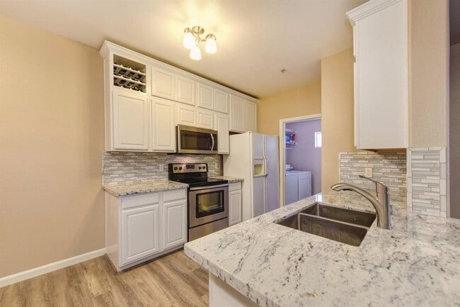 Building Photo - NICE 3 BEDROOM CONDO, 2 BATH, & 2 CAR GARA...